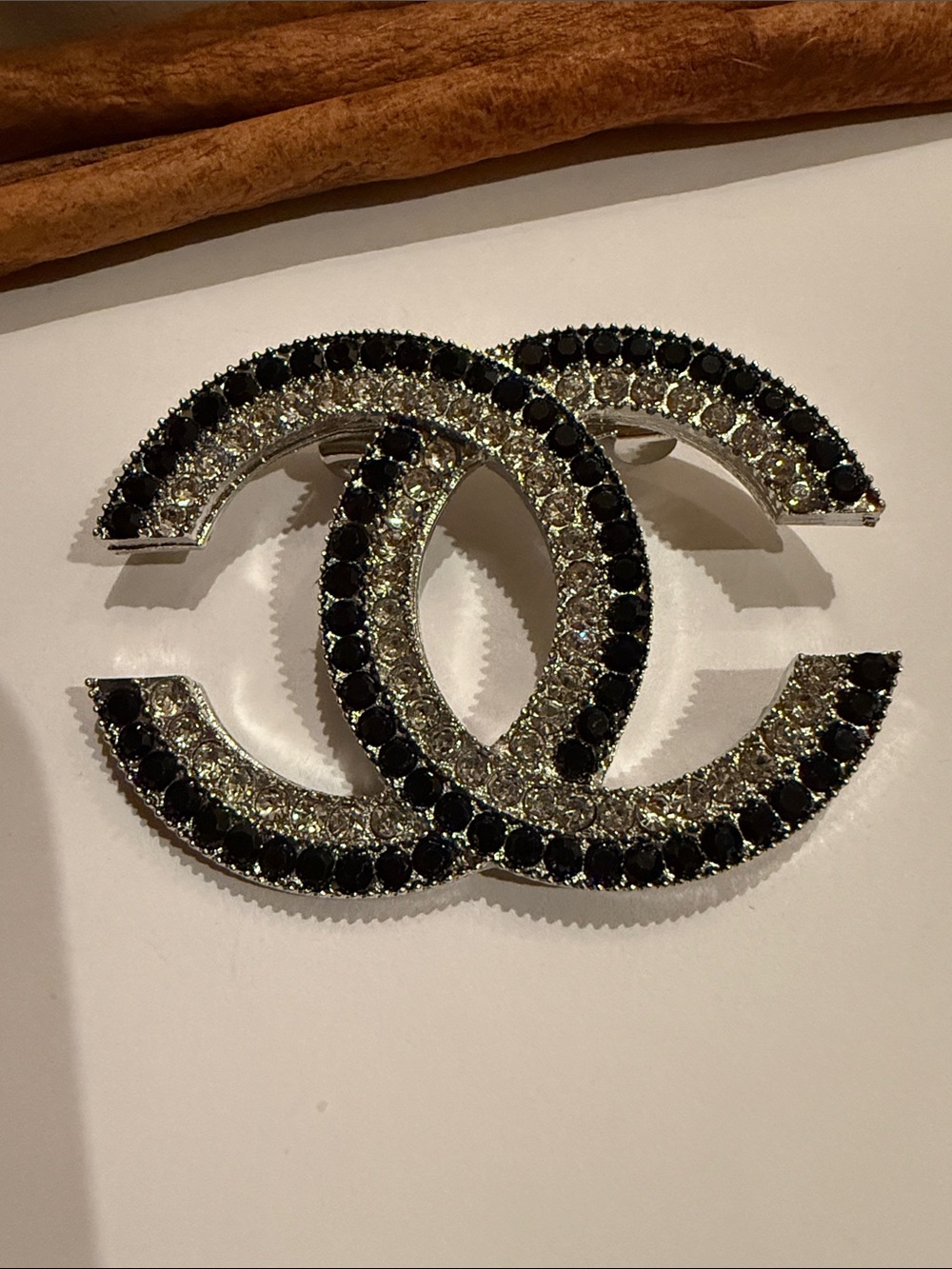 Black and Silver Crystal logo Brooch